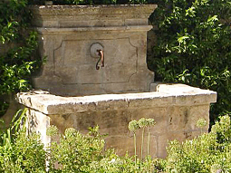 A beautiful 17th century antique reclaimed limestone wall fountain salvaged from the south of France